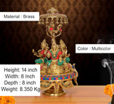 Brass idol with ornate parasol canopy over Lakshmi-Ganesha-Saraswati, multicolor, 14 in