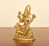 Golden brass Shiva on Nandi figurine, side angle, detailed ornaments