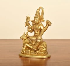 Golden brass Shiva on Nandi figurine, side angle, detailed ornaments