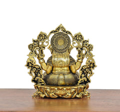 Golden brass Ganesha idol back view, seated figure with floral arch detailing