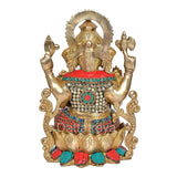 Back view of Brass Mangalkari Ganesh statue with jeweled waist and raised arms