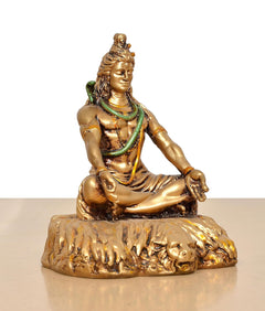 Lord Shiva resin statue side angle, gold body with green necklace and ornate seated base.