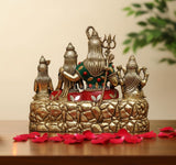 Shiv Parivar idol base with three seated figures, multicolor accents on robes