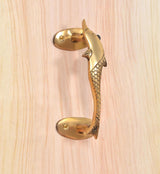 Golden brass dolphin fish door handle with U-shaped pull and scale-pattern details