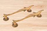 Brass dolphin fish door handle pair with curved lever and decorative scales