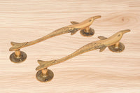 Brass dolphin fish door handle pair with curved lever and decorative scales