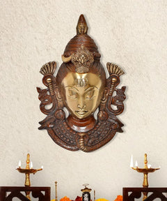 Brass Shiva face wall hanging mask with ornate arch, gold and dark brown detail