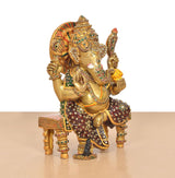 Ganesha statue with raised hands and ornate meenakari jewelry, brass seated on chowki