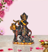 Brass Krishna deity statue with cow idol, playing flute, seated on base