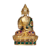 Seated brass Buddha statue with jeweled green robe and lotus base, 7.5 in tall.