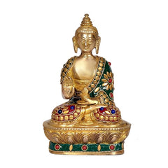 Seated brass Buddha statue with jeweled green robe and lotus base, 7.5 in tall.