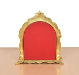 Metal Ram Darbar statue back: gold frame with red panel, no figures visible