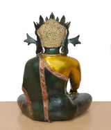 Back view of brass Buddha statue, seated posture with decorative neck drape and crown