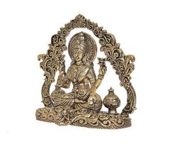 Lakshmi idol with arch frame and kalash pot on right, seated on ornate platform