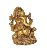 6-inch brass Ganesha statue, side view with halo, trunk curl, and patterned base