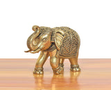 Bronze elephant figurine in profile, ornate filigree on back and head details