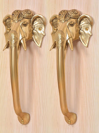 Brass Ganesha face door handle pair in golden finish, close view of elephant head details
