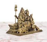 Shiv Parivar brass murti side view with trident staff and small seated figures on base