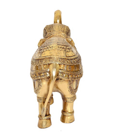 Brass elephant statue, front-facing view with ornate roof-like details on head