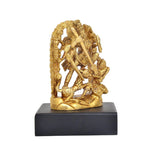 Golden brass Durga idol angled view, bow-and-sword stance, black pedestal base.