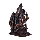 Brown brass Ganesha with Riddhi Siddhi idol statue, rear three-quarter view