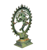 Side view of green Nataraja Shiva idol with spiked halo ring and ornate base