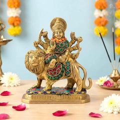 Brass Durga Maa figurine on lion with colorful jeweled detailing and raised arms