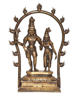 Brass Shiva and Parvati figurine with ornate arch and detailed pedestal base