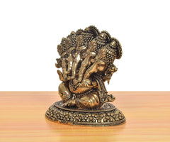 Panchmukhi Ganesha brass five-head murti, angled view with detailed face and base rim