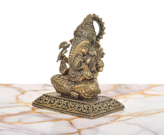 Superfine brass Ganesh statue, side view seated with ornate crown and trunk details