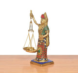 Side view Lady Justice brass statue with balance scales, multicolor jewel patterns