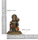 Brass Hanuman JI idol with height 4.5 in and width 3.5 in shown on ruler diagram