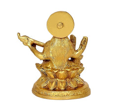 Back view of brass Saraswati figurine on round base with halo disc