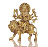 Brass Durga Maa figurine on lion with raised hands and detailed jewelry