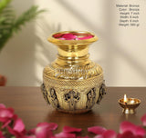 Bronze brass kalash showpiece with intricate deity reliefs and decorative lotus top