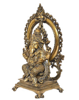 Natural brass Ganesha idol on throne, side view with arched halo