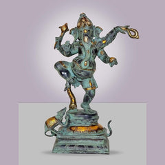 Dancing Ganesha idol statue with turquoise finish and gold accents, raised arms