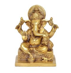 Brass Ganesha idol with four arms, detailed crown, square base, 7 inch height