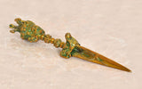 Handmade brass dagger pendant with ornate green-gold detailing and dorje-style handle