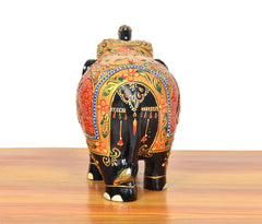 Wooden elephant showpiece back view, colorful floral trims and arched decorative panel