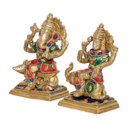 Brass Lakshmi & Ganesha idol set, front view of two seated deity figures with bases