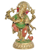 Brass dancing Ganesha figurine, red skirt with green patterns and blue gem eyes