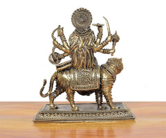 Bronze Durga Maa idol on tiger, back view showing patterned drape and crown