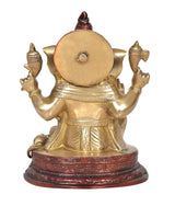 Brass Ganesha statue rear view with round back plate and red engraved base