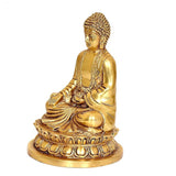 Gold Buddha sitting statue, side view with folded hands on lotus pedestal