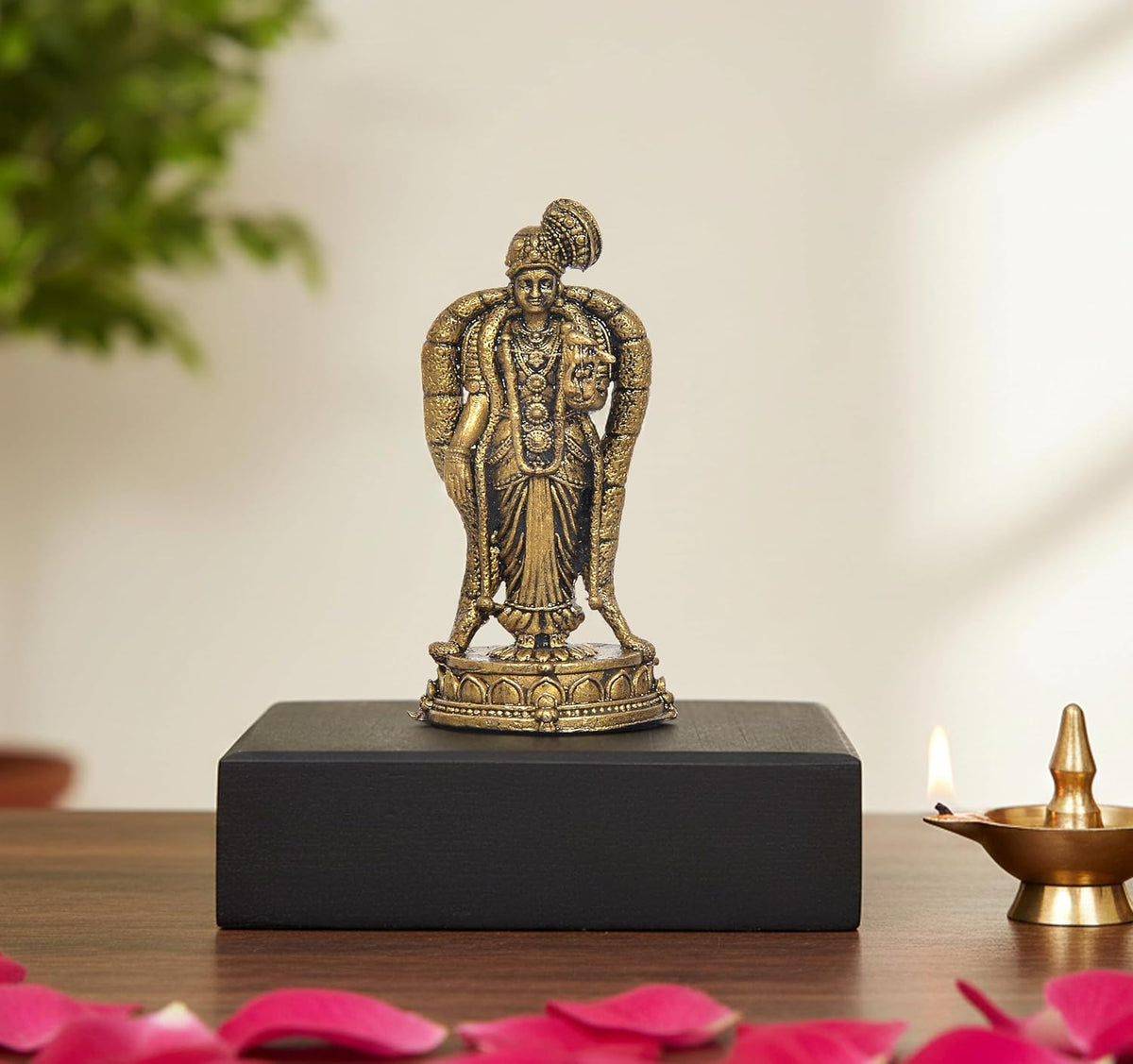 Gold-toned Meenakshi idol figurine on round base, height 2 inch