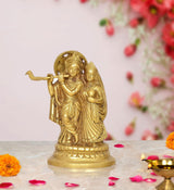Gold-tone Radha Krishna brass idol statue, Radha holding Krishna, standing on base