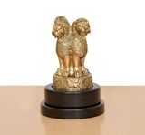 Brass Ashoka figurine with sculpted garland details on revolving dark base plaque