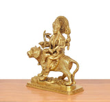 Brass Durga Maa riding lion, golden, angled rear view