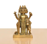 Golden brass Trimurti idol, ornate three faces, seated, raised hands, 4.5 in